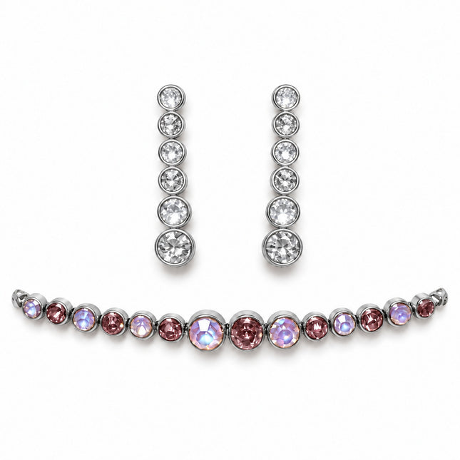 Variante del set con orecchini a pietre trasparenti e bracciale nelle tonalità rosa e lilla iridescenti.