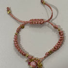 Bracciale Capri intrecciato rosa e oro con charm campanella regolabile stile boho chic