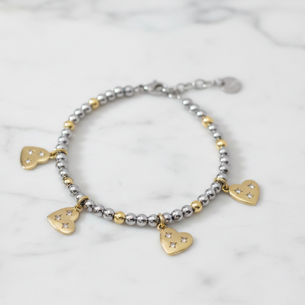 Bracciale 2JEWELS 232347 sfere bicolore silver gold con 4 ciondoli cuore cristalli su marmo bianco