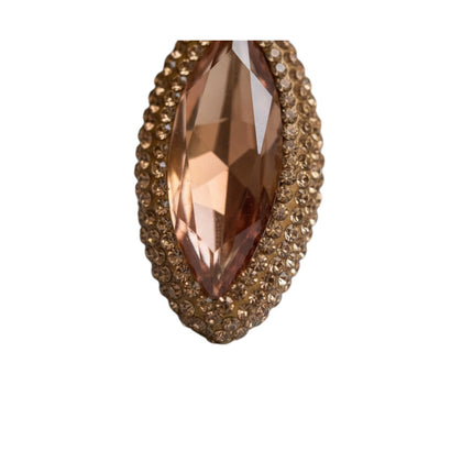 Dettaglio macro zircone champagne taglio marquise: sfaccettature e riflessi