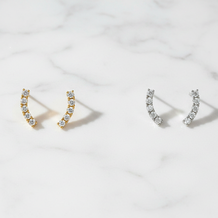 Coppia orecchini Shelly Ear Climber oro e silver - flat lay