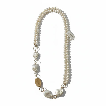 Tempo A Tempo long necklace featuring white cultured baroque pearls and gold-tone accents, handcrafted design.