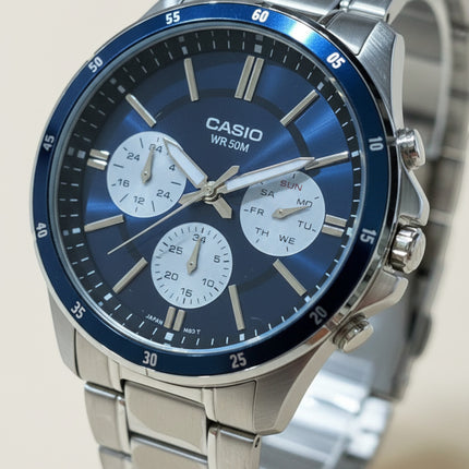 Tempo A Tempo Casio MTP-1374D stainless steel watch with a blue multifunction dial and silver bracelet