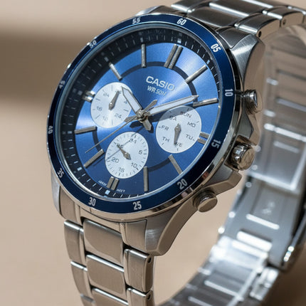 Tempo A Tempo Casio MTP-1374D men's watch with a blue dial, stainless steel bracelet, and multifunction sub-dials.