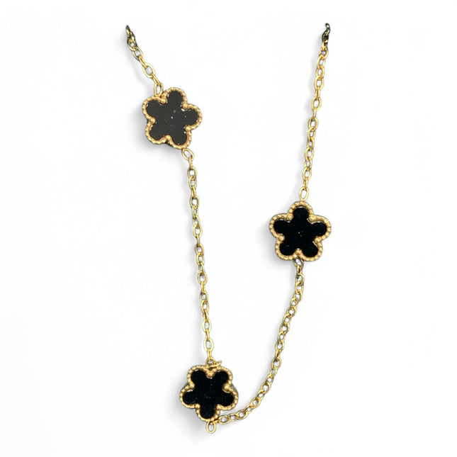 Collana Tempo A Tempo in acciaio dorato con tre ciondoli a forma di fiore nero lucido e catena sottile
