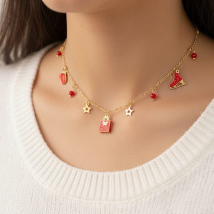 Collana Tempo A Tempo in acciaio oro con ciondoli natalizi rossi, pattino, pacchetto regalo e stelline