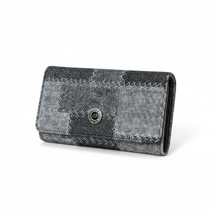 Tempo A Tempo Coveri continental wallet in grey and black denim patchwork fabric with a silver logo button closure.