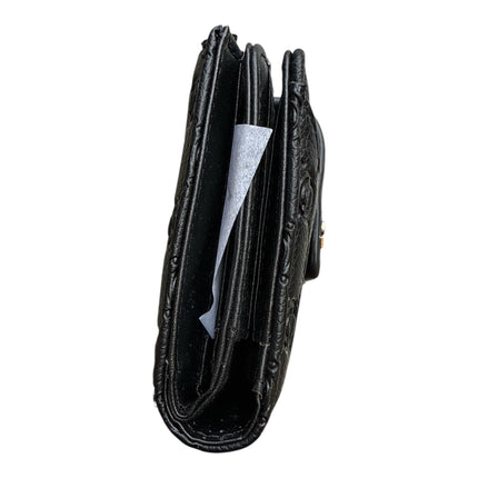Tempo A Tempo black Coveri World compact wallet in embossed faux leather with side view showing internal compartments