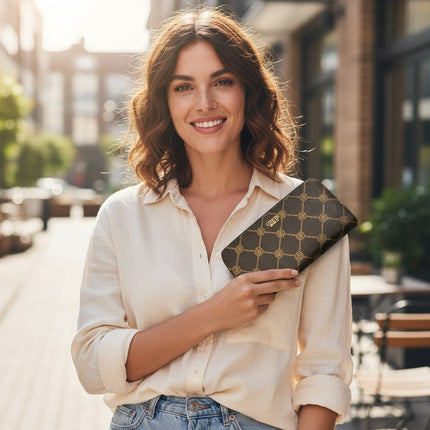 Tempo A Tempo woman holding a brown Enrico Coveri faux leather wallet with a geometric print and gold logo