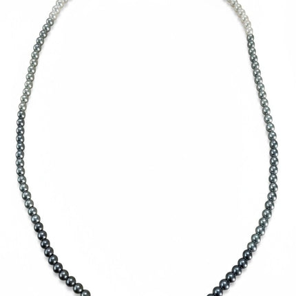 Tempo A Tempo Shelly necklace featuring a gradient of grey and white glass pearls with a stainless steel clasp.