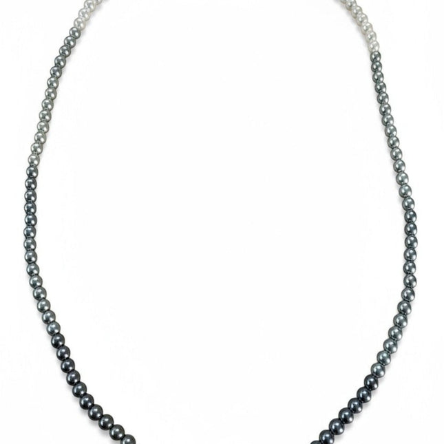 Tempo A Tempo Shelly necklace featuring a gradient of grey and white glass pearls with a stainless steel clasp.