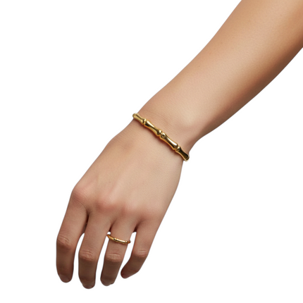 Tempo A Tempo gold bamboo effect rigid bracelet for women, polished metal, minimalist design.