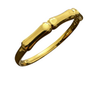 Tempo A Tempo gold-tone metal rigid bracelet with bamboo-effect segments and a polished finish.