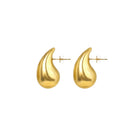 Tempo A Tempo gold drop earrings, polished metal, sculptural design, elegant and chic.