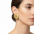 Tempo A Tempo gold geometric earrings with a hollow central drop shape and 3D texture. Lightweight alloy.