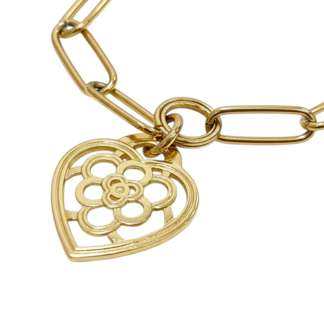 Tempo A Tempo gold-tone stainless steel wide link bracelet with a hollow heart charm featuring a floral design.