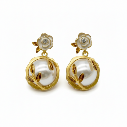Tempo A Tempo elegant gold drop earrings with white floral design and large pearl.