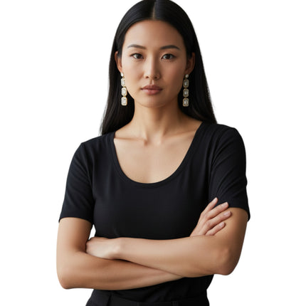 Tempo A Tempo gold-plated stainless steel drop earrings with three rectangular white zircon halo pendants and pavé detailing.