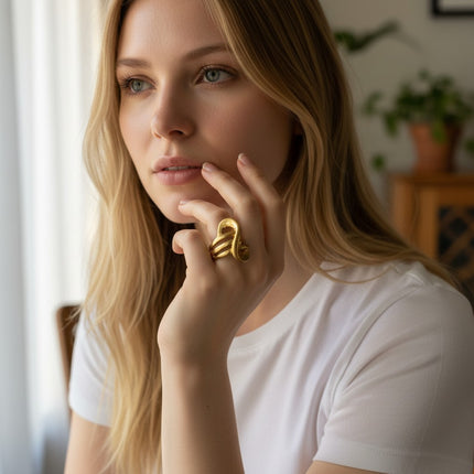 Tempo A Tempo gold-tone stainless steel open sculptural ring, size 18. Modern statement jewelry.
