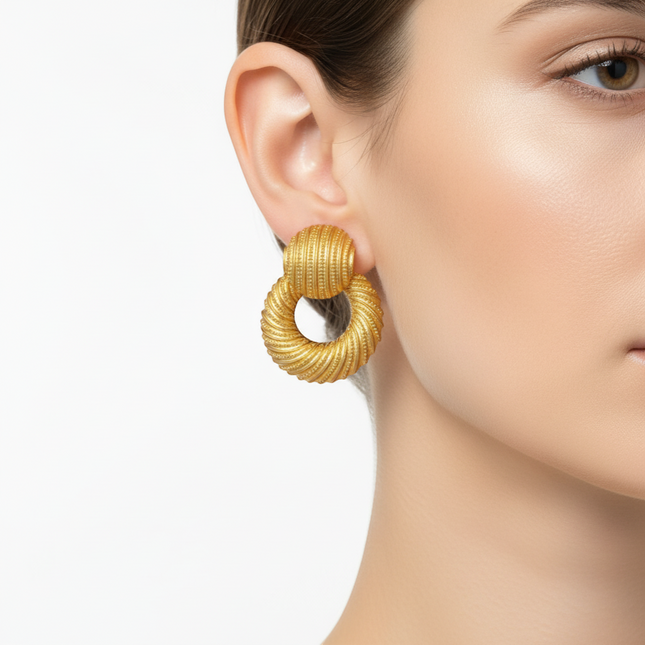 Tempo A Tempo gold resin hoop earrings with textured spiral design and stud top.