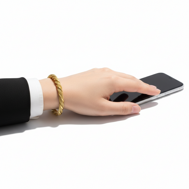 Tempo A Tempo gold-tone stainless steel twisted cuff bracelet with rounded ends. Classic, refined, unisex design.