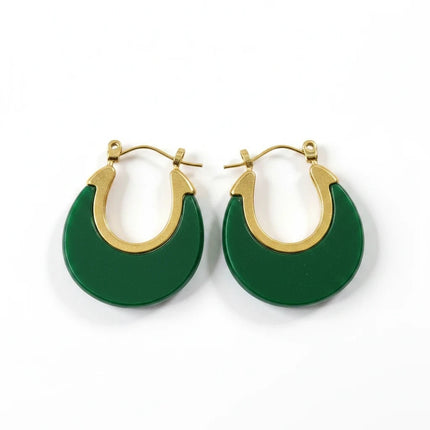 Tempo A Tempo Shelly dangling earrings featuring a green resin crescent design on gold-tone steel with hook closure.