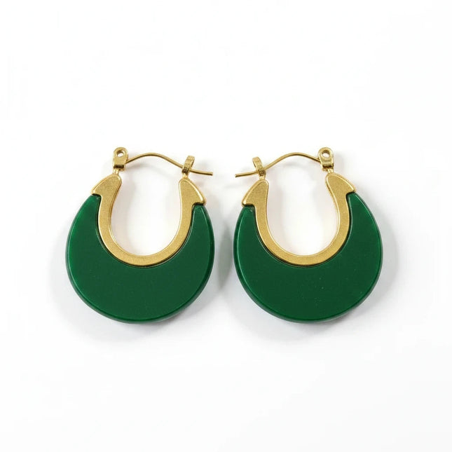 Tempo A Tempo Shelly dangling earrings featuring a green resin crescent design on gold-tone steel with hook closure.