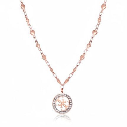 Tempo A Tempo Guess gold-tone stainless steel necklace featuring a crystal-encrusted logo pendant and heart chain