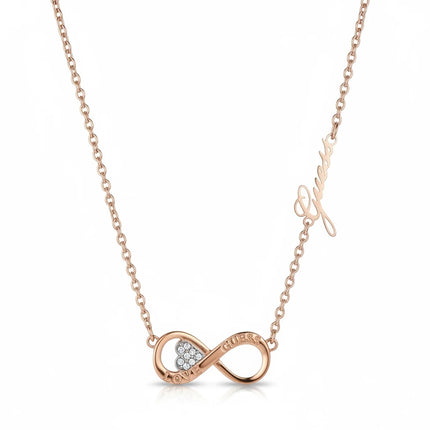 Tempo A Tempo GUESS rose gold infinity necklace with crystal heart detail and brand logo charm on a delicate chain