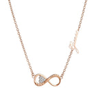 Tempo A Tempo GUESS rose gold steel necklace featuring an infinity pendant with crystal heart and logo detail