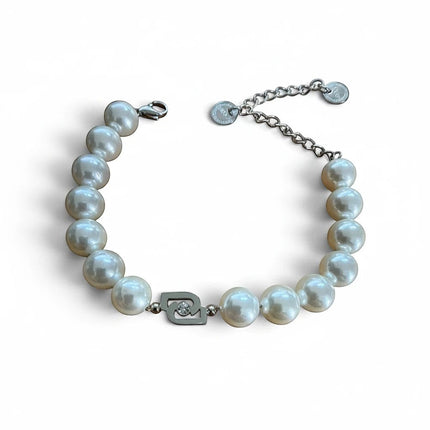 Tempo A Tempo Liu Jo pearl bracelet with silver steel logo charm and white zircon detail on a white background