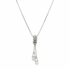 Tempo A Tempo long stainless steel necklace with a heart pendant, sparkling zirconia, and two white pearl drops.