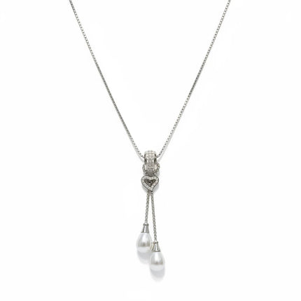 Tempo A Tempo long stainless steel necklace with a heart pendant, sparkling zirconia, and two white pearl drops.