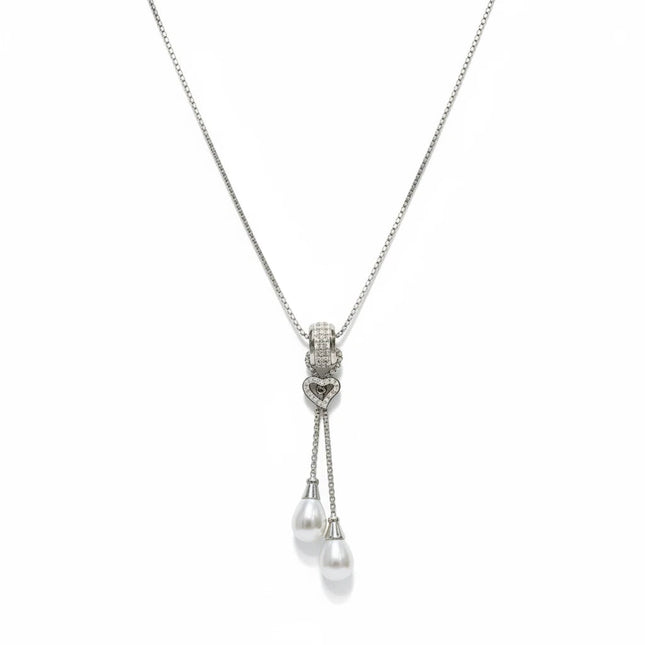 Tempo A Tempo long stainless steel necklace with a heart pendant, sparkling zirconia, and two white pearl drops.
