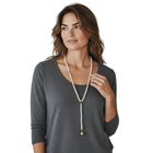 Tempo A Tempo long pearl necklace with gold sphere pendant, vintage elegant style.