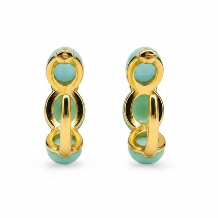 Orecchini a cerchio Tempo A Tempo in acciaio dorato con doppio cabochon in resina verde menta, design moderno.