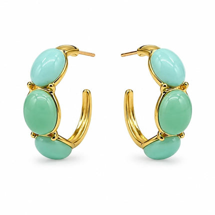Orecchini a cerchio Tempo A Tempo in acciaio dorato con cabochon in resina verde menta, design moderno ed elegante.