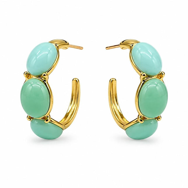 Orecchini a cerchio Tempo A Tempo in acciaio dorato con cabochon in resina verde menta, design moderno ed elegante.