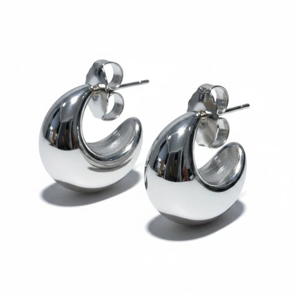 Orecchini Tempo A Tempo Shelly a mezzaluna chunky in acciaio 316L color argento lucido, design moderno e minimalista.