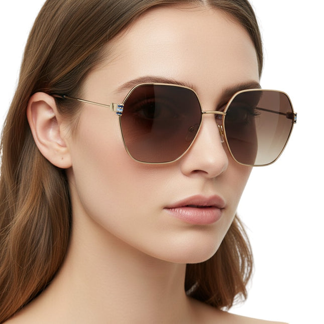 Tempo A Tempo women's oversized geometric sunglasses with gold frame and gradient brown UV lenses. Decorative detail on temples.