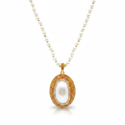 Tempo A Tempo Shelly pearl necklace with a gold oval pendant featuring sparkling rhinestones and a white pearl center