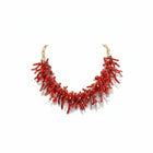 Tempo A Tempo ethnic style choker necklace with red synthetic coral branches and gold beads on a white background