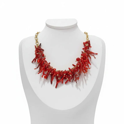 Tempo A Tempo ethnic style choker necklace featuring red synthetic coral branches and gold beads on a white mannequin