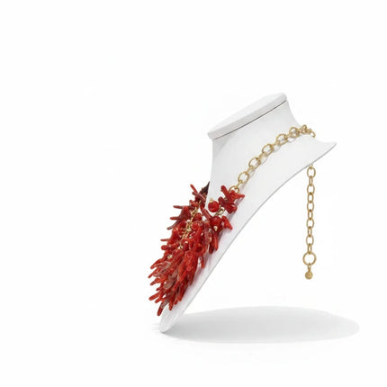 Tempo A Tempo ethnic style choker necklace with red synthetic coral branches and gold beads on a white display bust.