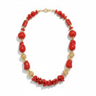 Tempo A Tempo statement necklace with red coral-effect resin beads and ornate gold-tone metal spheres for ceremonies.