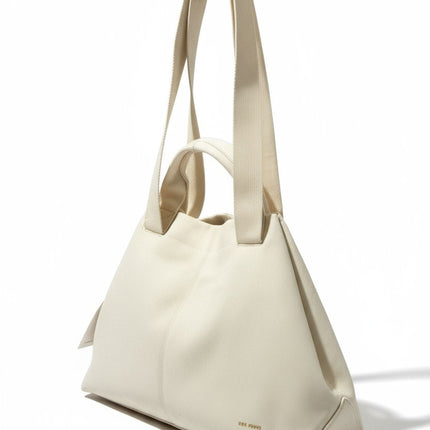 Tempo A Tempo Regina Schrecker beige faux leather handbag with dual handles and adjustable shoulder strap
