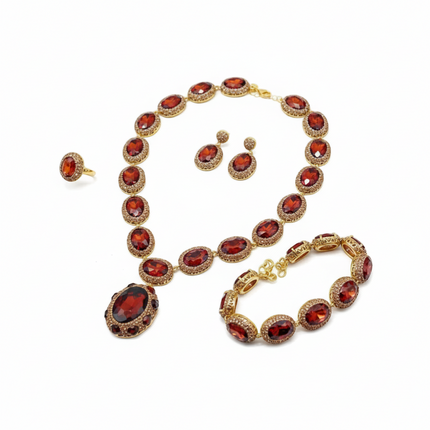 Tempo A Tempo vintage 4-piece ruby red crystal and gold-tone jewelry set with necklace, bracelet, earrings, and ring.