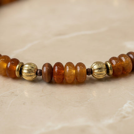 Tempo A Tempo Shelly boho chic necklace featuring amber-colored beads and gold-toned metallic accents