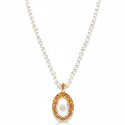 Tempo A Tempo Shelly necklace with white pearls and a gold-tone oval pendant featuring sparkling rhinestones