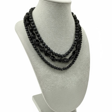 Tempo A Tempo Shelly three-strand necklace featuring dark blue synthetic beads on a jewelry display bust